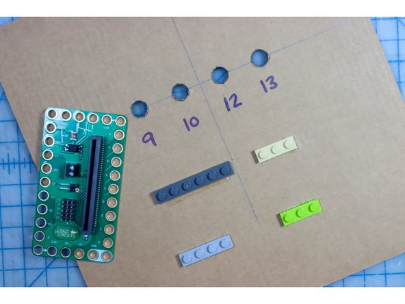 Glue LEGO in place, making sure that the holes for pins 9, 10, 12, 13, and GND have a LEGO peg inside them. The other LEGO are just for support.