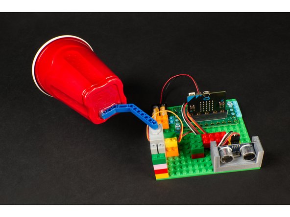 You may want to test the circuit before you attach the cup to the beam, just to make sure you know which orientation you need to place the beam on the servo, and how you want the cup glued in place.