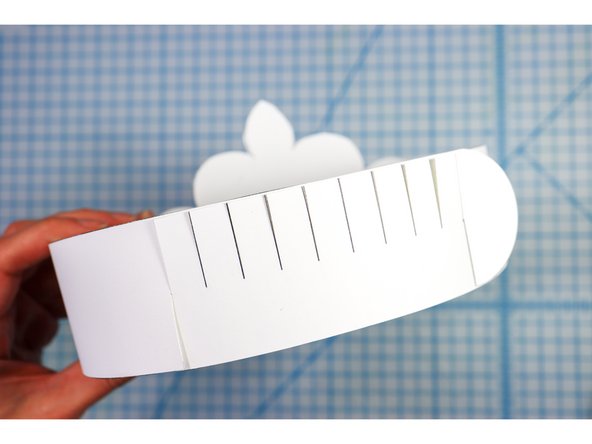 Interlock the slits in two places to create the size that works for your head.