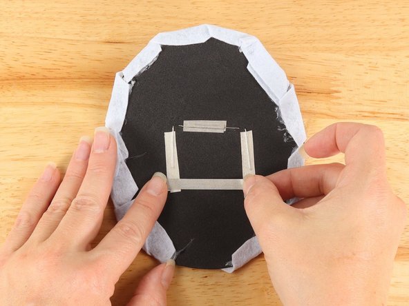 Use a piece of Maker Tape to connect the two outside (Negative) pathways.