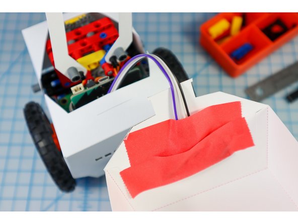 Use a few pieces of tape to hold it in place.