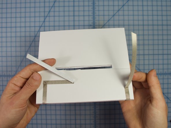 Run the Maker tape to the back of the base piece, and leave some extra to connect later.