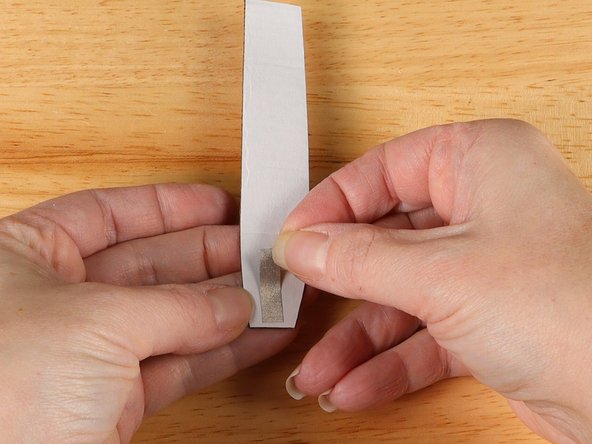 Flip over the handle and add a small piece of Maker Tape to the back of the handle at the bottom.