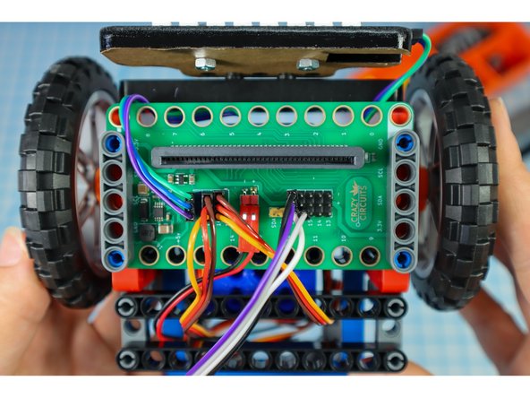 Reposition the Bit Board so that the blue pins go thru the last hole as shown.