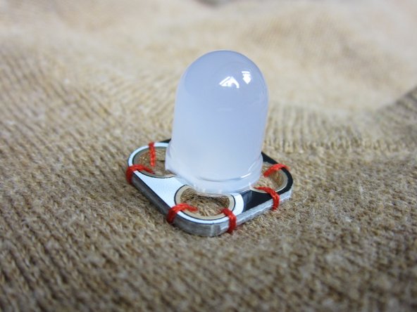 Using regular thread sew down your electronics.