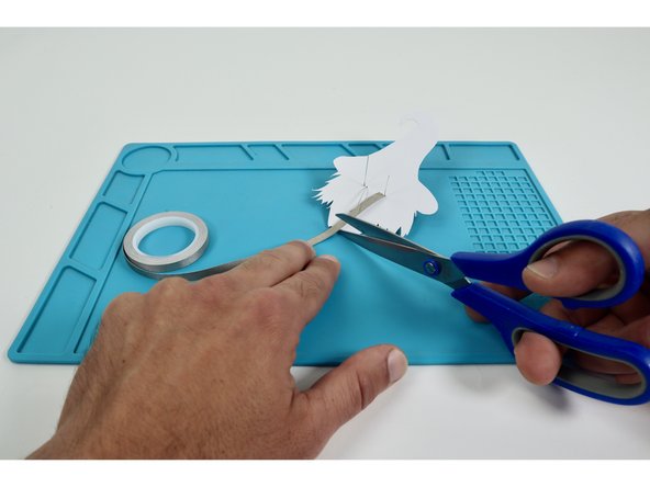 Measure and cut three pieces of Maker Tape that are approximately the length of the Long LED Legs.