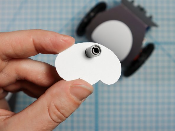 Use two more pin/beam sets to attach the feet and front of the penguin body to the front of the Rover.