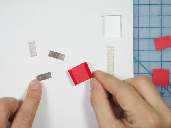 Cut small pieces of Maker Tape to cover the inside of the flap as shown.