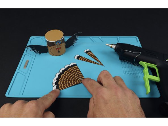 Use hot glue to add any included embellishments.