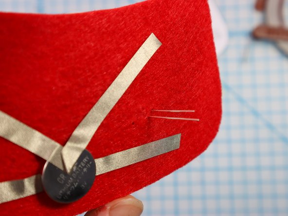 Insert each LED through the holes with the longer, positive leg in the top hole.