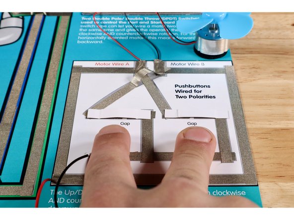 Position each of the prepared pushbuttons over each of the gaps as shown with the Maker Tape side facing down toward the rest of the existing pathways.