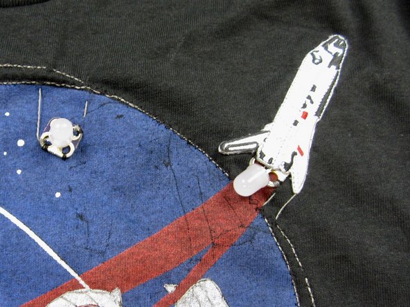 If you're using a Shuttle patch, sew it on now using regular thread.