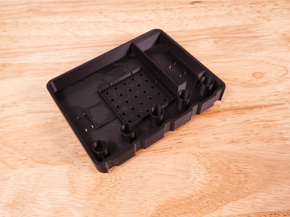 Flip the 3D Printed Micro:Bit over and you'll see the legs of the buttons sticking up. We're going to bend them flat so the buttons don't fall out.