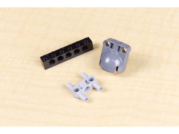 Our caster wheel allows our robot to roll, powered by the two wheels attached to the servos, with the caster acting as the &quot;third wheel&quot; so our robot can pivot and move easily.