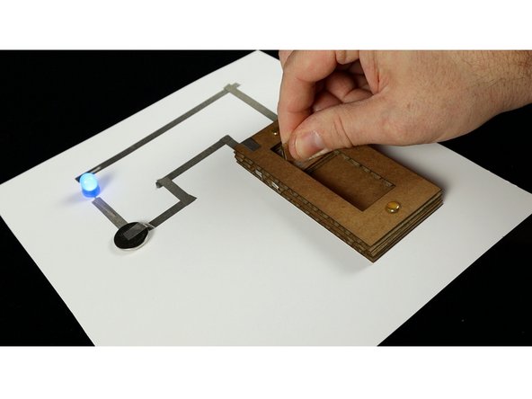 We built a simple circuit using an LED, a battery, and some Maker Tape, and then connected our switch into it. It worked great!