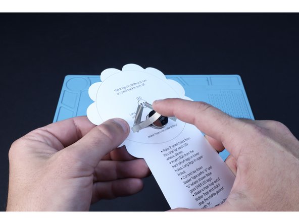 Peel and stick the final Maker Tape path that leads from the long leg path to the top of the the battery as shown.