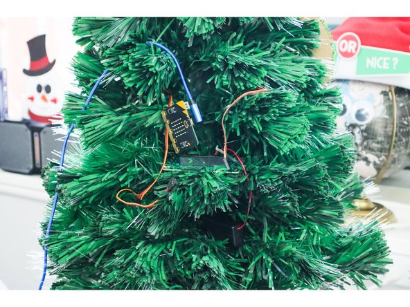 Reassemble the circuit on the tree, then stuff it inside the branches so that you can't see it.