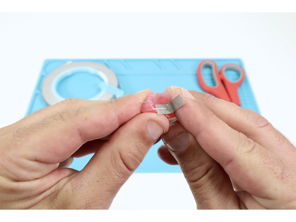 Cut more pieces of Maker Tape of the same length and repeat this process for each of the remaining  LED legs.