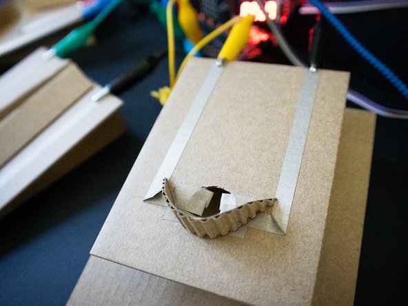 Using alligator clips, connect one side of each switch to ground, and the other to pin 0, 1, 2, and/or 3. In the example code, we connected all of the switches at once.