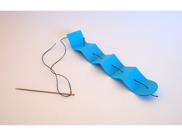 Make sure to start from the rounded end of the tentacle, and on the outside of the zig-zag fold