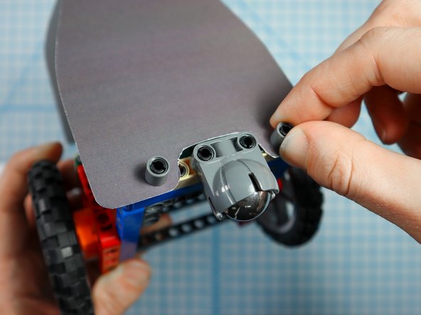 Use two pin/beam sets to connect the back of the penguin body to the Rover.