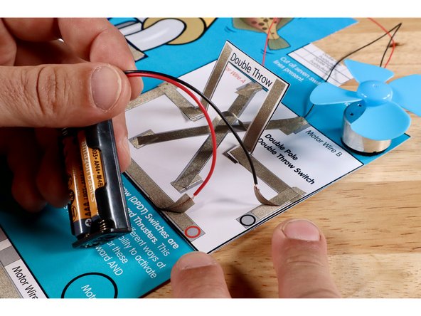 Measure, cut, peel, and stick Maker Tape paths shown in the first image. The Negative (-) Black Circle Path will bring electricity into the switches. The Positive (+) Red Circle Paths will allow the current to return to the voltage source.