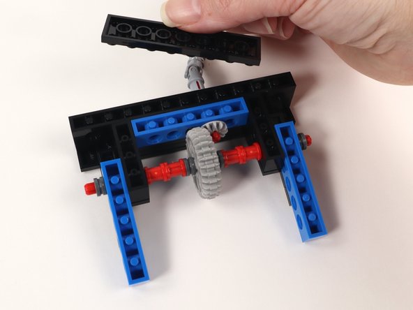 Now that you have connected Section 1 and Section 2 flip the build over and add a 2x8 plate to the bottom center of the build. This will help keep the sections together.