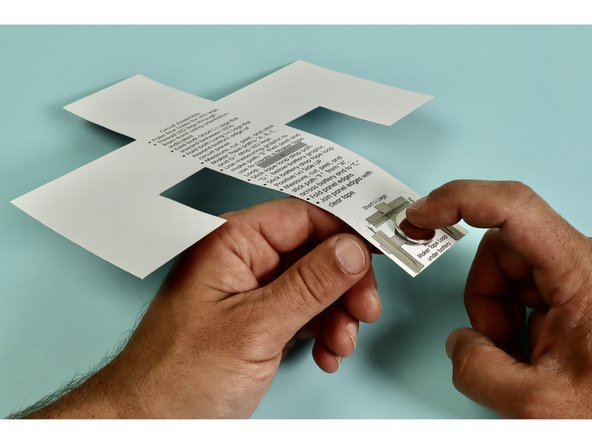 Install battery by pressing it into place atop the tape loop Positive (+) Side UP.