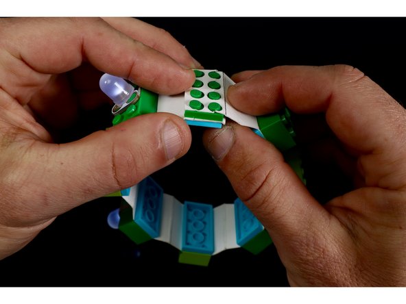 Pick one of the two remaining ends that you have punched and sandwich it between two 2x4 PLATES (same stud orientation as all the rest).