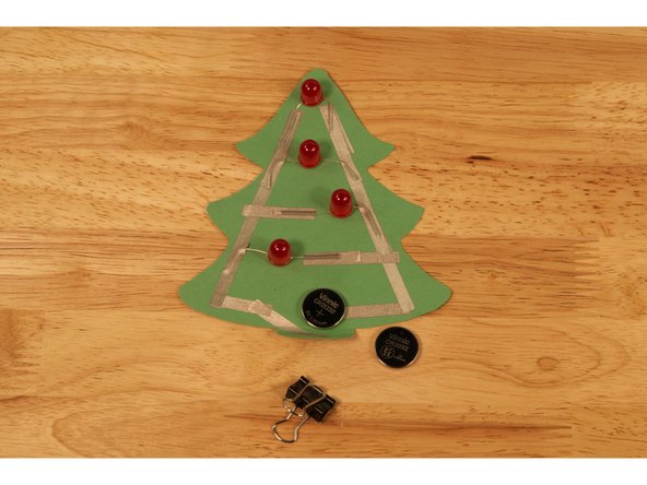 One fresh CR2032 battery should be enough to light up your tree, but if it seems dim you can add a second battery.