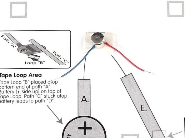 Stick the motor to the double sided tape making sure the back of the motor (with the wires) is stuck down to the tape and the part that spins faces upwards so it can move freely.