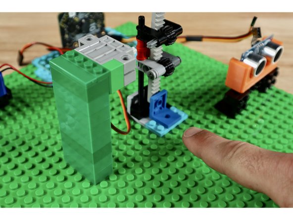 With spacing loosely gauged, press each of the subsystems into place atop the baseplate. Note: There are two unused pieces that are used near the base of the gear rack to firm up its connection and limit the downward travel of the vertically-oriented rack.