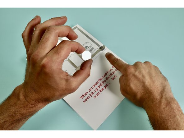 Install battery atop tape loop POSITIVE SIDE UP.