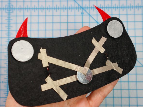 Peel the paper backing off of each hook and loop dot and place it where shown on the template.