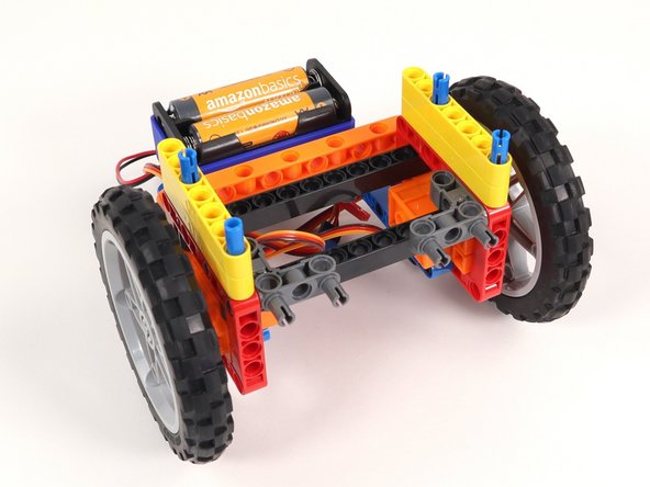 Since 2/3rds of the blue pins are sticking out, you'll need to make sure to push the yellow beams down all the way so they are touching the other yellow beams. 1/3 of the blue pins should still be sticking out.