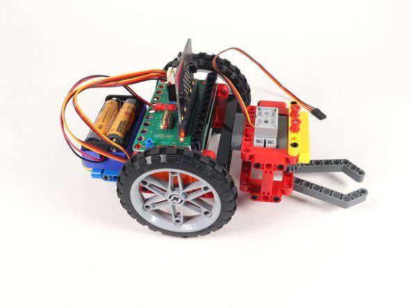 Just use the pins sticking out the back of the Gripper to attach to the front beam on the Rover.