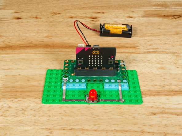 Connect the Negative (-) side of the LED to a Ground (GND) hole on the Bit Board.