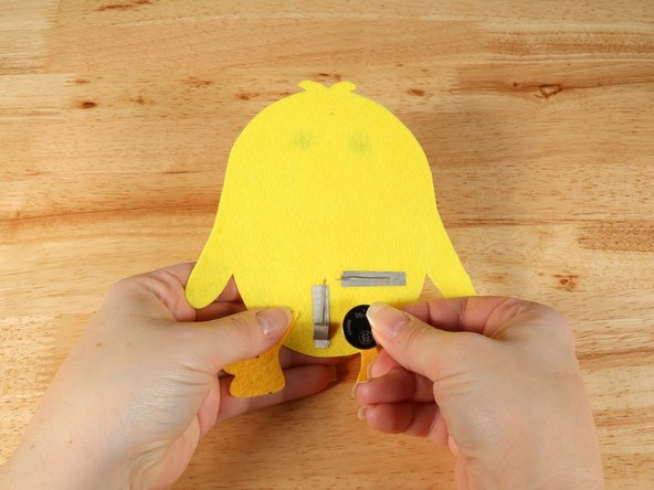 Make sure the Positive side of the Battery is facing upwards, with the Negative side stuck down to the tape.