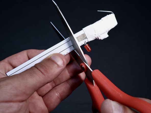 With a scissors, carefully trim along the template lines leaving you with a frilly, narrower section.