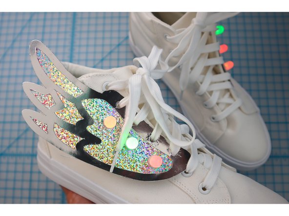 Unlace the shoes, then lace the shoes back up through the holes.