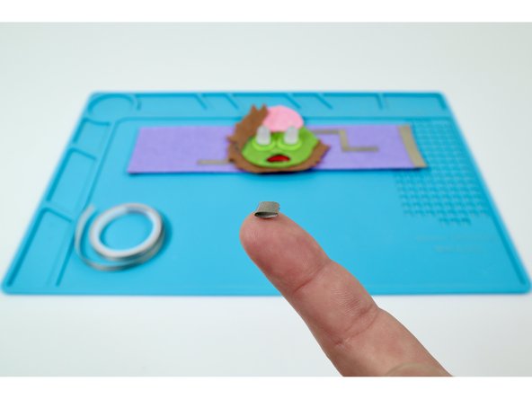 Make a tape loop (sticky-side-out) with that last piece of Maker Tape that you just cut at the end of the last guide step.