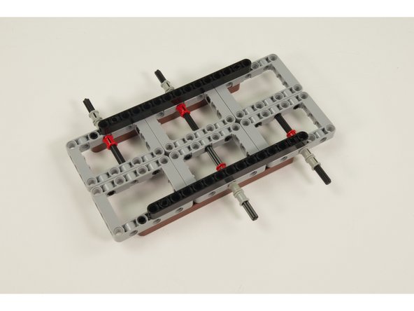 Use 12 LEGO Bushing to hold the axles in place.