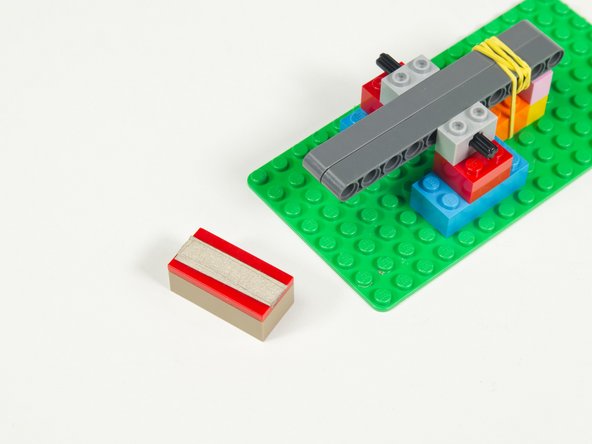 Remove the Contact Brick (the one with the flat tile) and add Maker Tape to it.