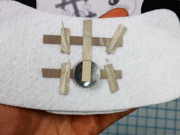 Place a piece of Maker Tape on top of each leg to make a secure connection.