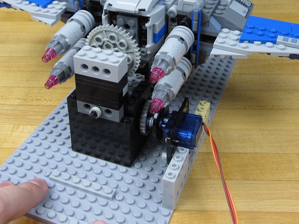 Press the Bushing up next to the worm gear.