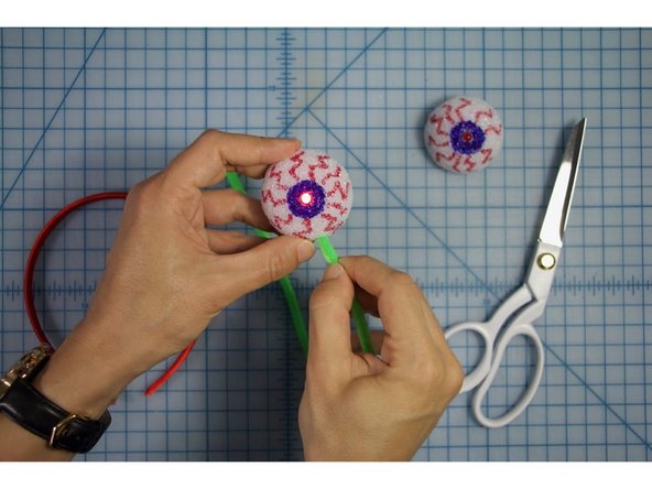 Insert the ends of the pipe cleaners into each of the styrofoam balls.