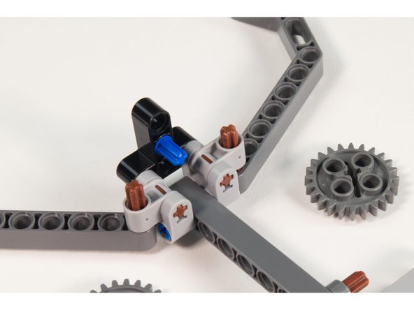 You will need to remove the gears to add the pin. Leave them off until Step 15.