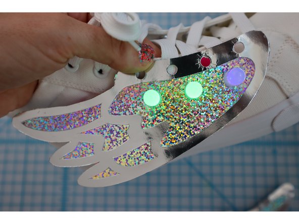 Unlace the shoes, then lace the shoes back up through the holes.