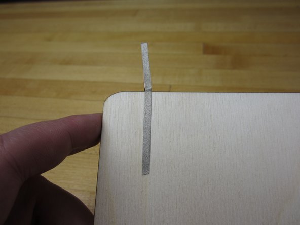 We're using a piece of wood for our paint surface, but a piece of cardboard or paper would work just fine.