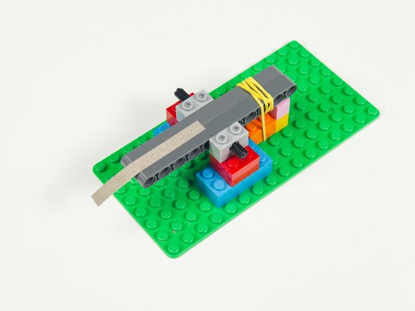 Add a strip of Maker Tape down the center of the beams so it holds them together.